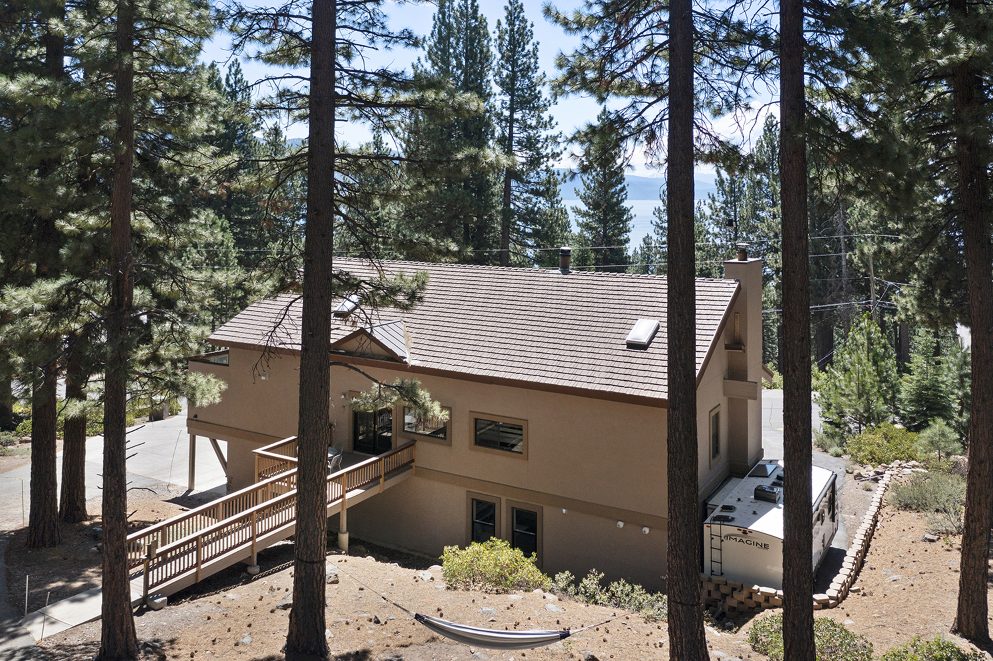 Back view of Kinpine House surrounded by pine trees